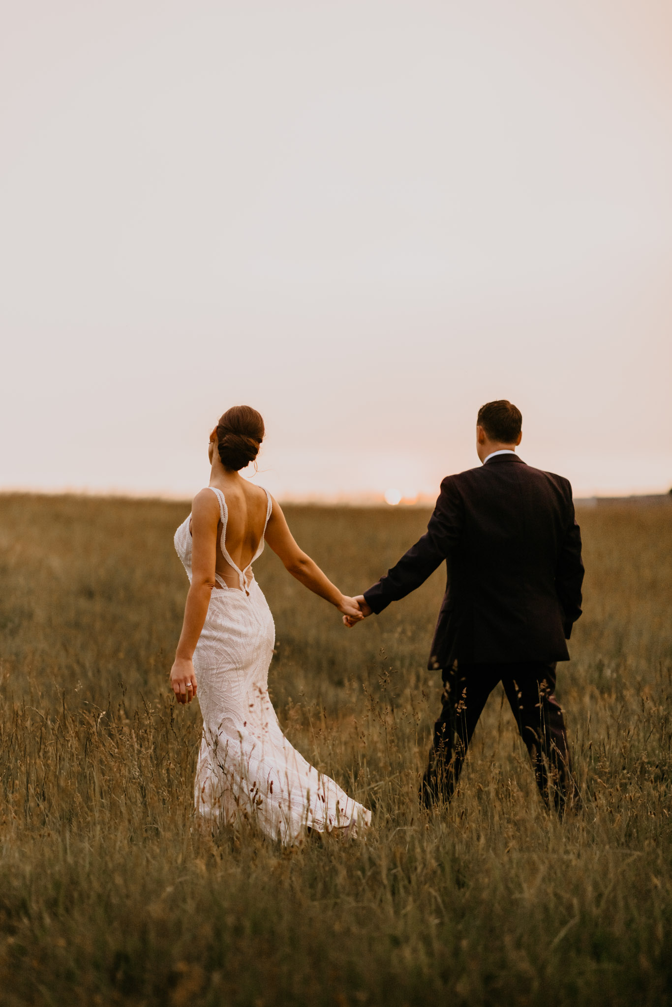Moody golden hour wedding portrait in an open Massachusetts field